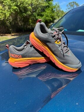 Hoka Gray Running Shoes with Orange and Coral Soles